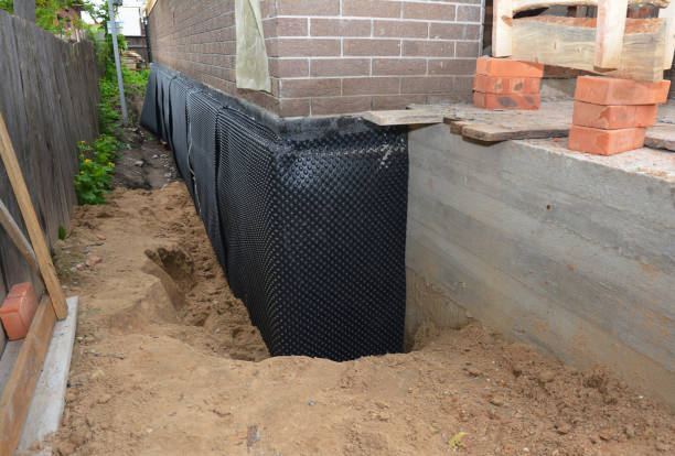 SJ Waterproofing Pros technician performing targeted Emergency Waterproofing assessment in Glen Ellyn, IL